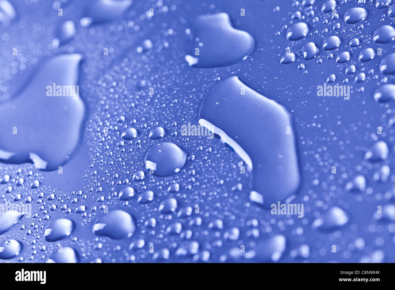ice cubes and water drops on the blue background Stock Photo - Alamy