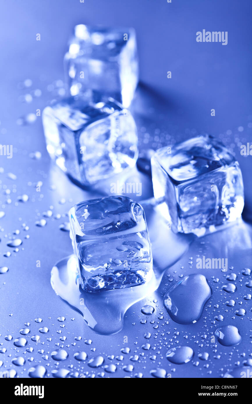 ice cubes and water drops on the blue background Stock Photo - Alamy