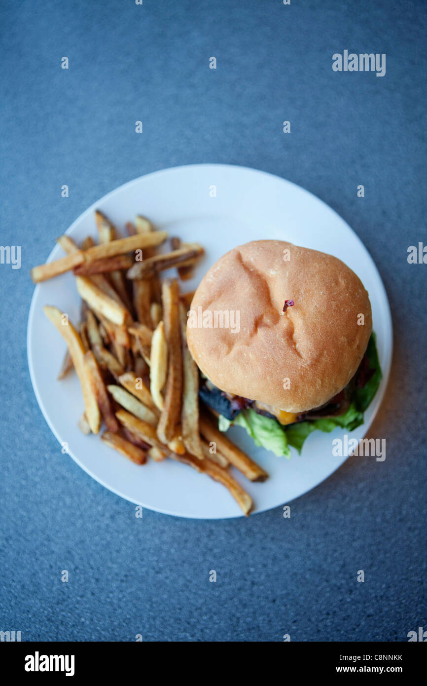 Cheeseburger and french fries Stock Photo