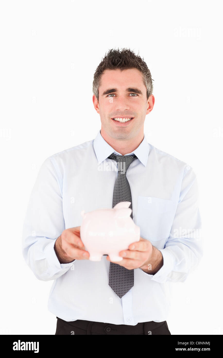 Man holding a piggy bank Stock Photo - Alamy