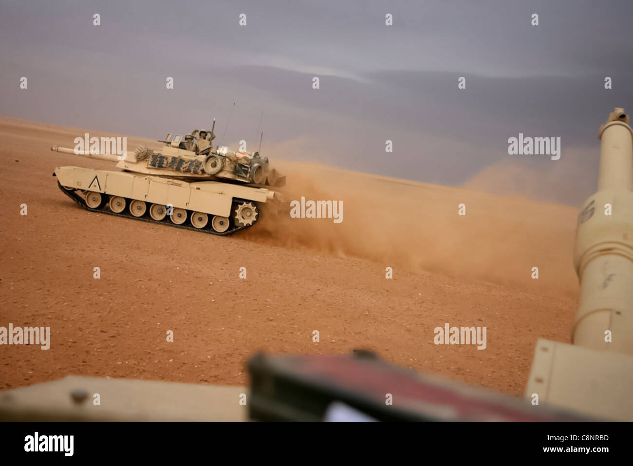 Two M1A1 Abrams Main Battle Tanks patrol with Task Force Mech, Regimental Combat Team 5 in al-Anbar Province, Iraq, Nov. 29. Task Force Mech consists of Marines and sailors with Company A, 2nd Tank Battalion, in conjunction with elements of Company B, 1st Light Armored Reconnaissance Bn., and 1st Combat Engineer Bn. The Marines and sailors with Task Force Mech are conducting various missions in al-Anbar province to include presence patrols and humanitarian missions. Stock Photo