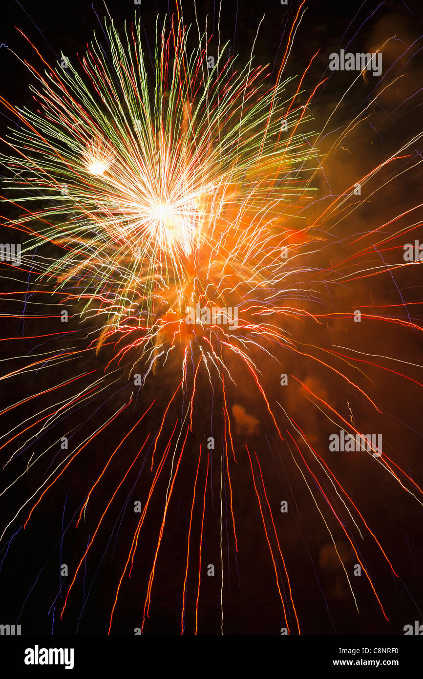 Fireworks exploding in sky Stock Photo