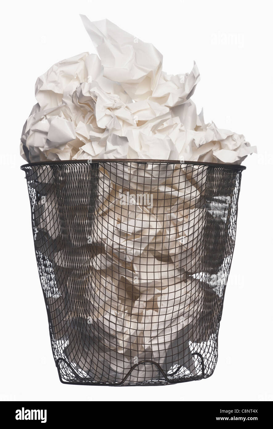 Wastepaper basket full of garbage Stock Photo