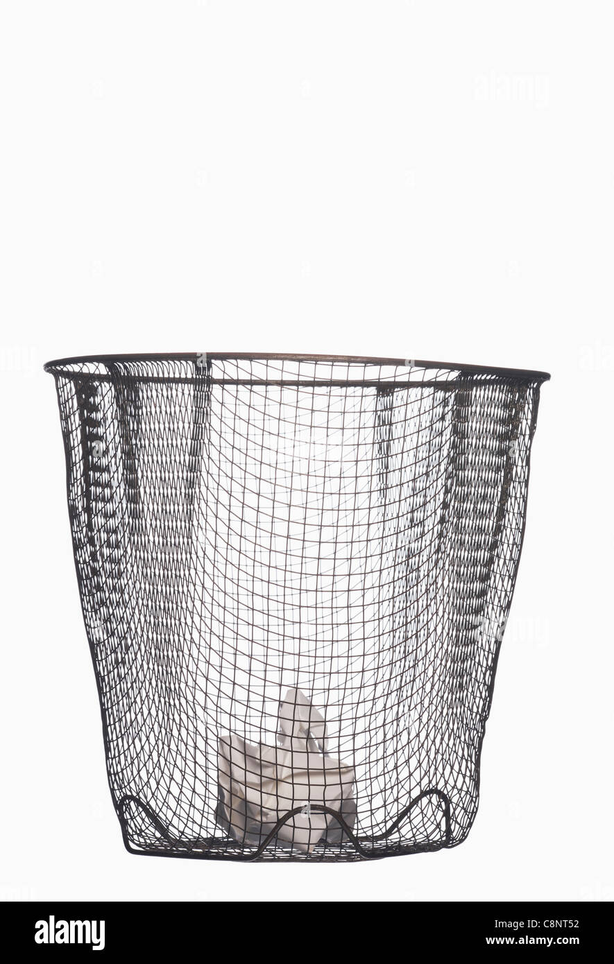 Crumpled paper in wastepaper basket Stock Photo