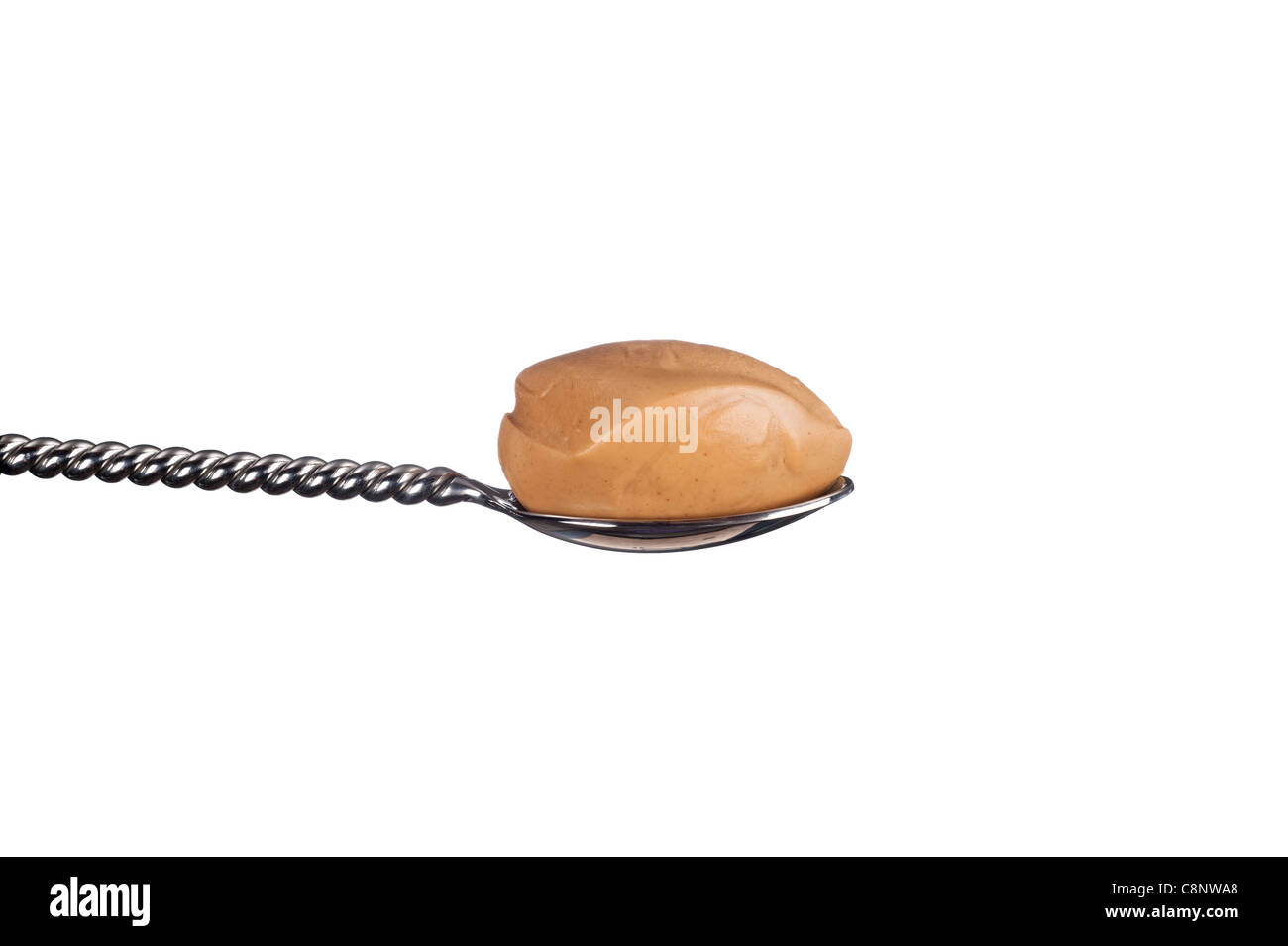A spoonful of creamy peanut butter isolated on white Stock Photo