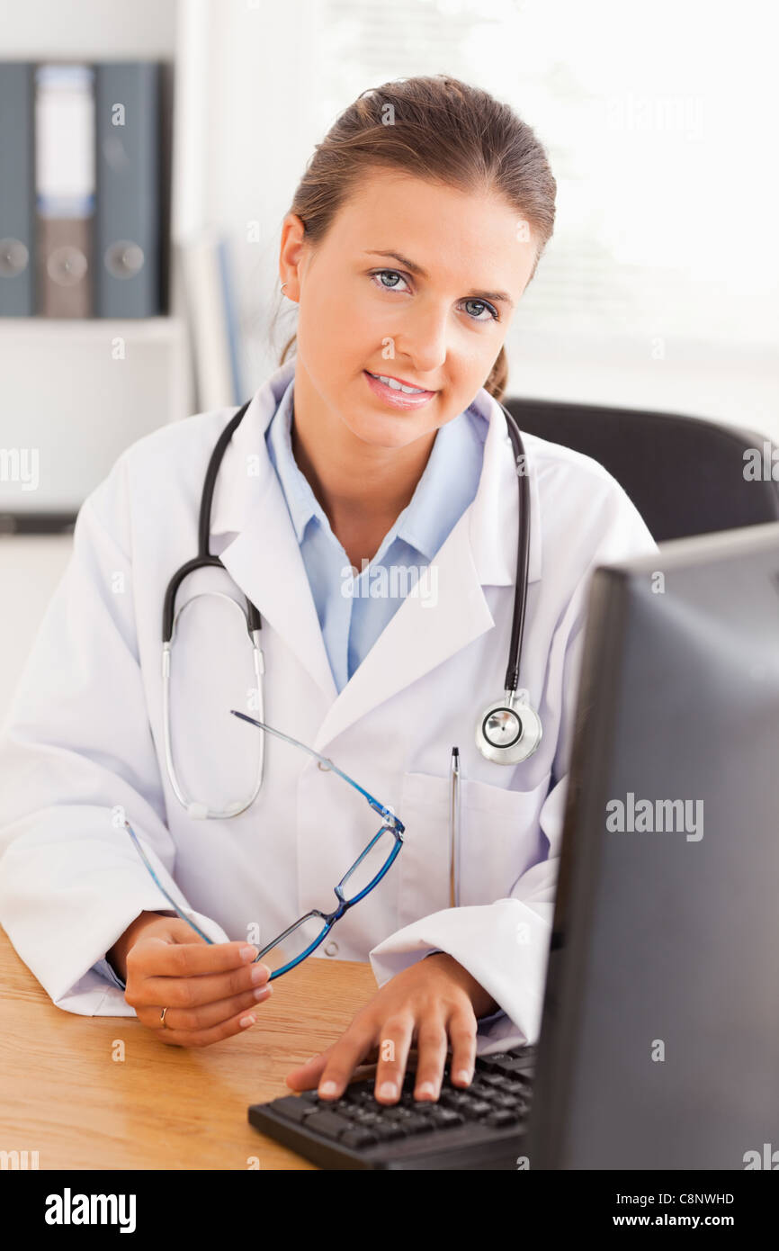 Doctor working with her computer Stock Photo - Alamy