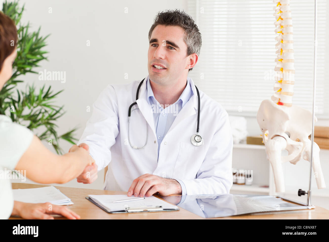 Doctor Greeting A Patient Stock Photo Alamy