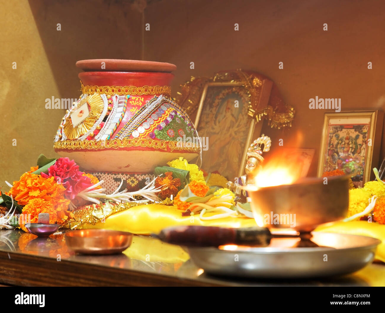Hindu Hinduism religion religious worship of Navratri  and festival of lights with puja at home with decorated clay pot matti Stock Photo