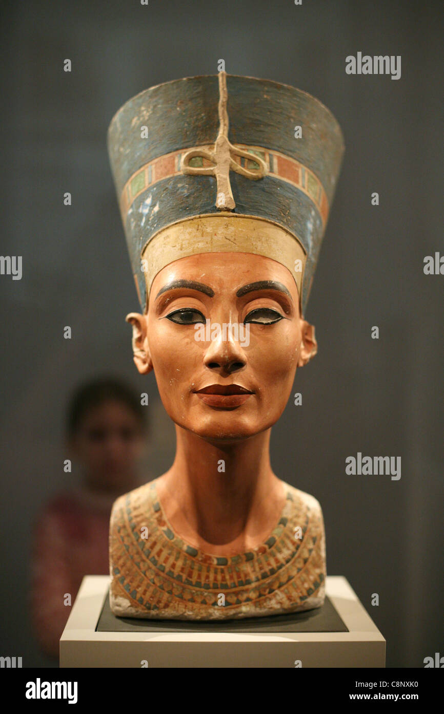 Young visitor looks at the famous bust of Queen Nefertiti in the