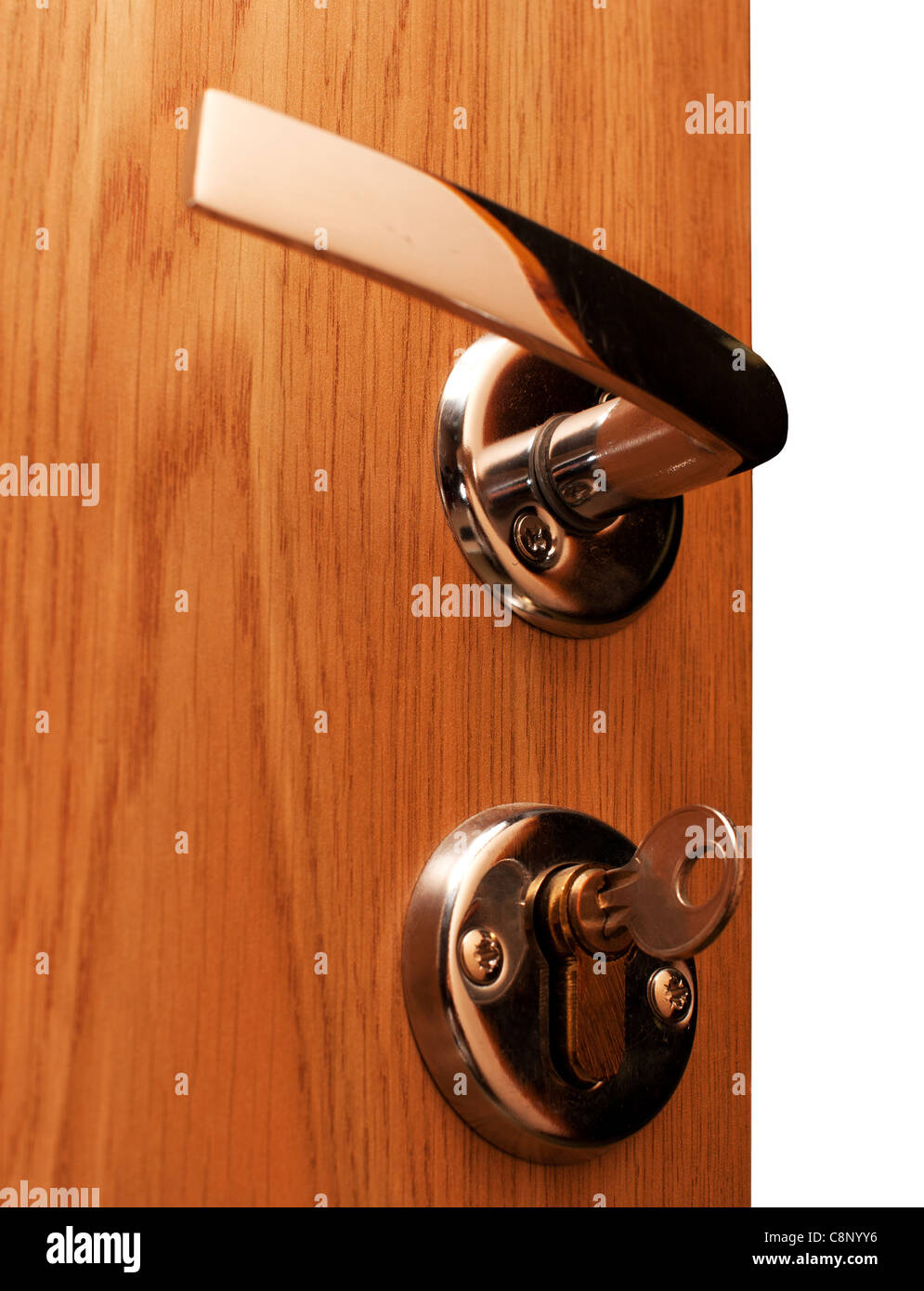 Wooden doorway with shiny keyhole, key inserted Stock Photo Alamy