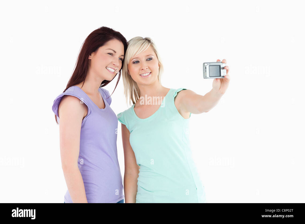 Cheerful women with a camera Stock Photo - Alamy