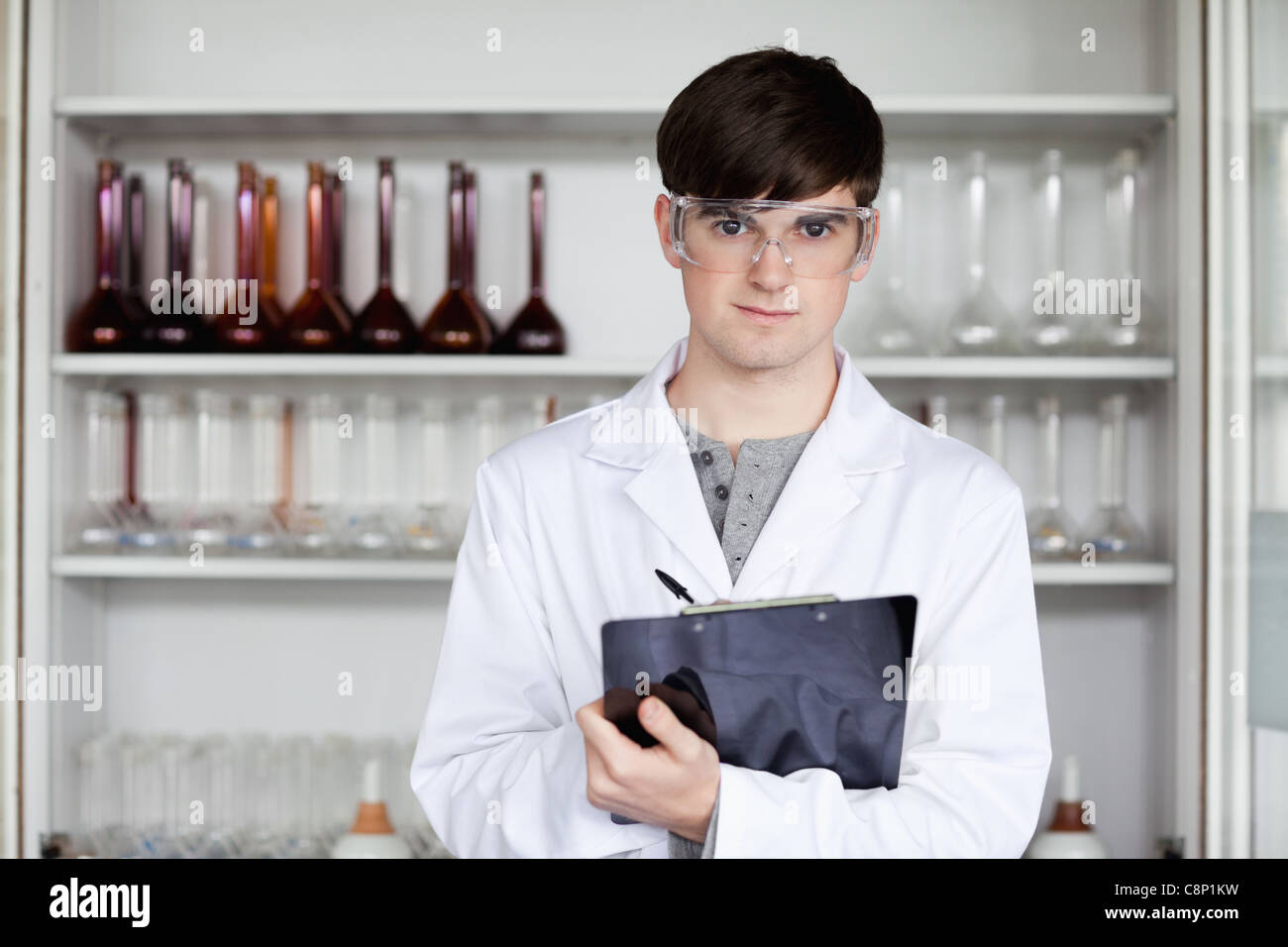Science research man writing hi-res stock photography and images - Alamy