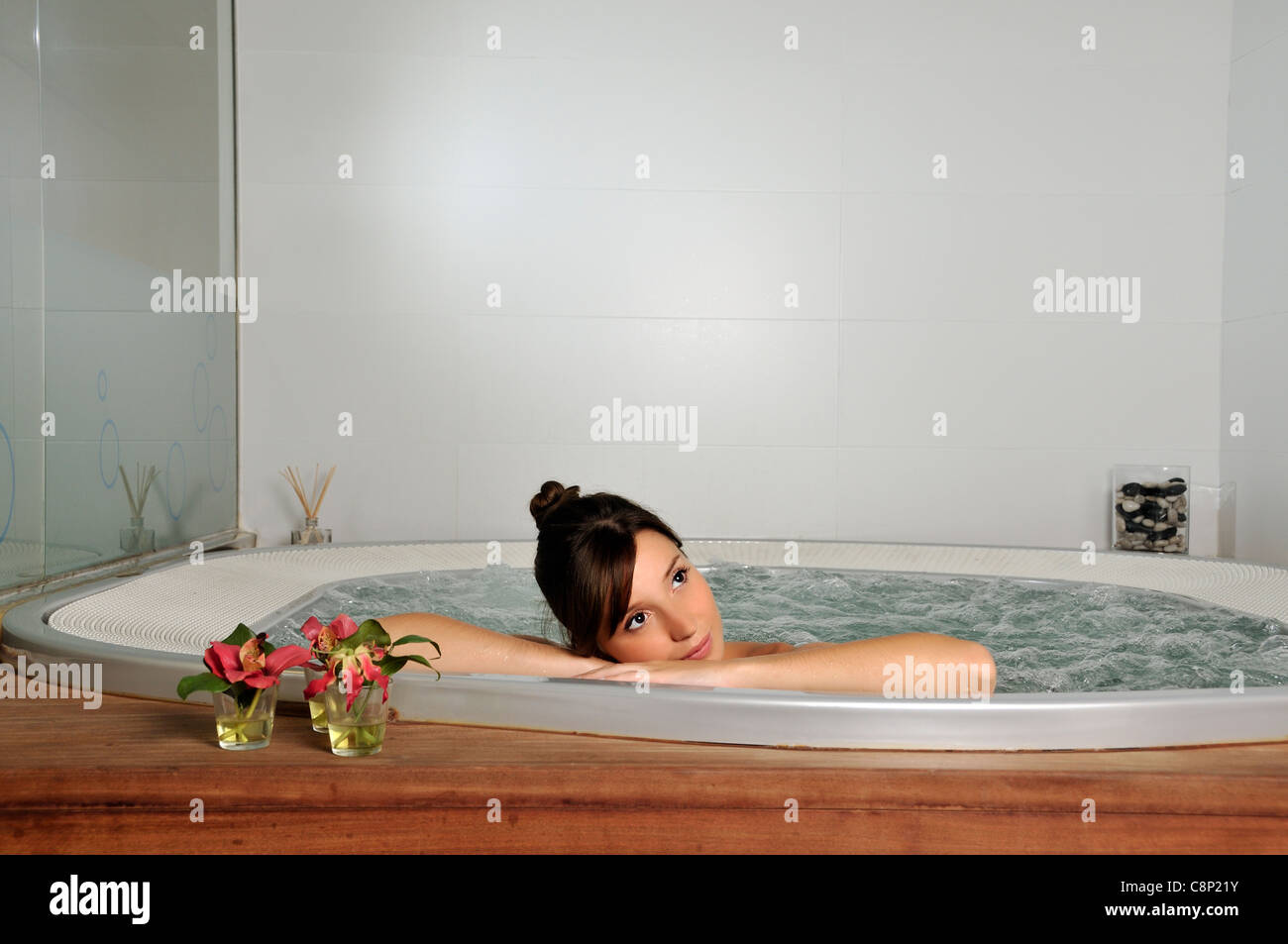 Woman relaxing in jacuzzi Stock Photo