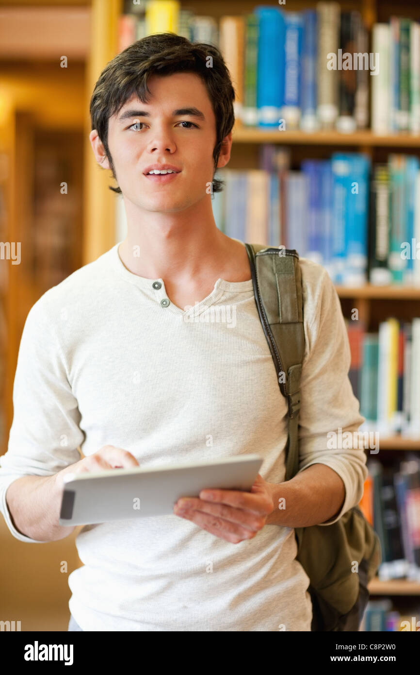 Portrait of a serious student holding a tablet computer Stock Photo