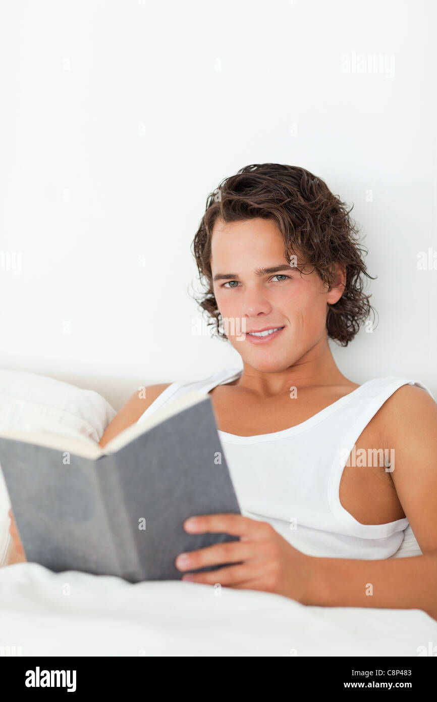 Portrait of a man holding a book Stock Photo - Alamy