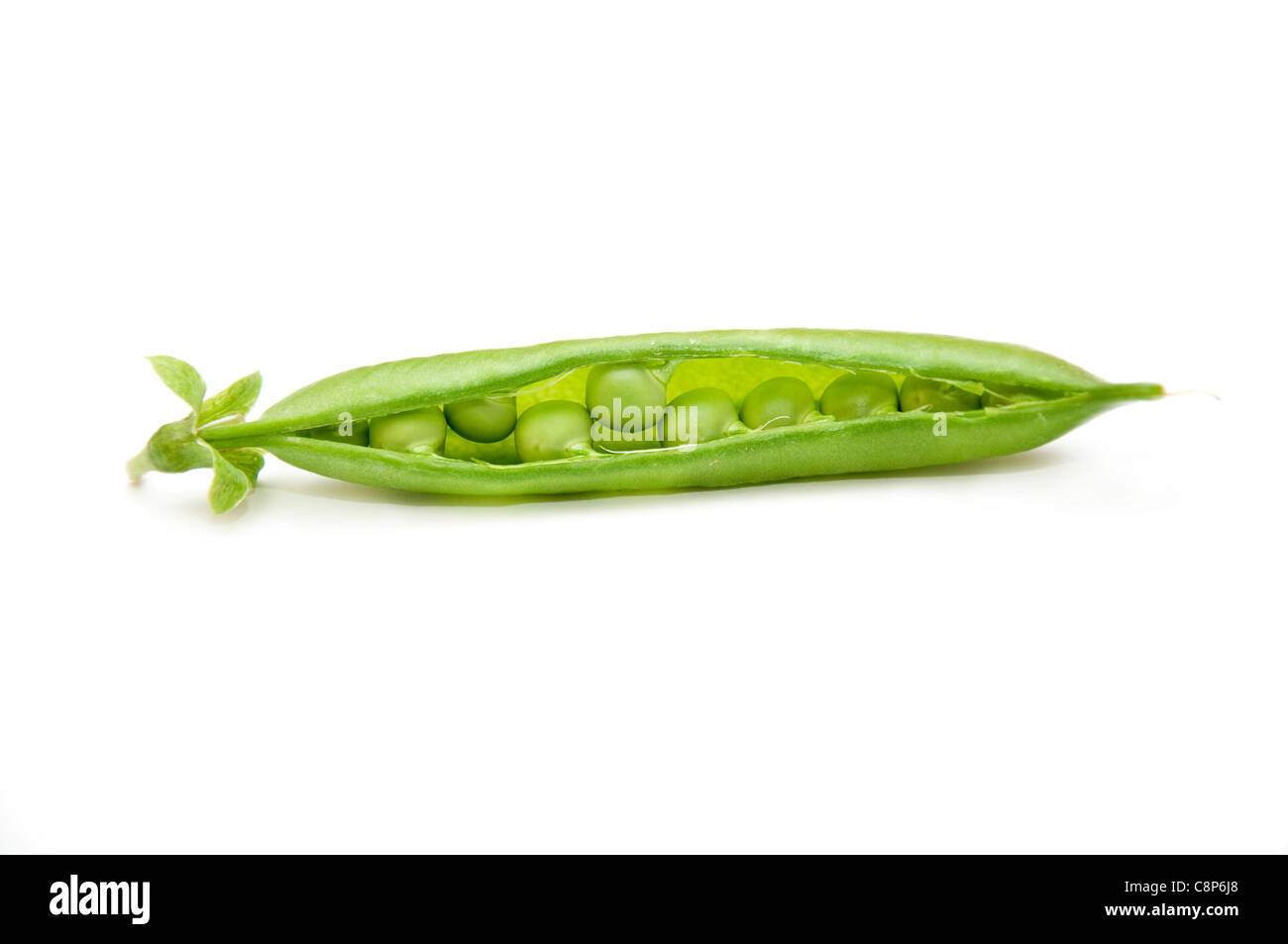 Green peas pods over a white background Stock Photo - Alamy