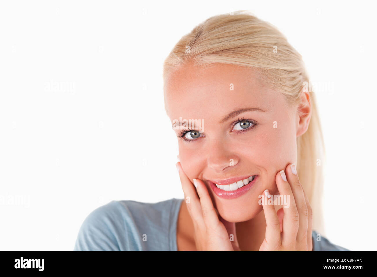 Cute blonde woman smiling at the camera Stock Photo - Alamy