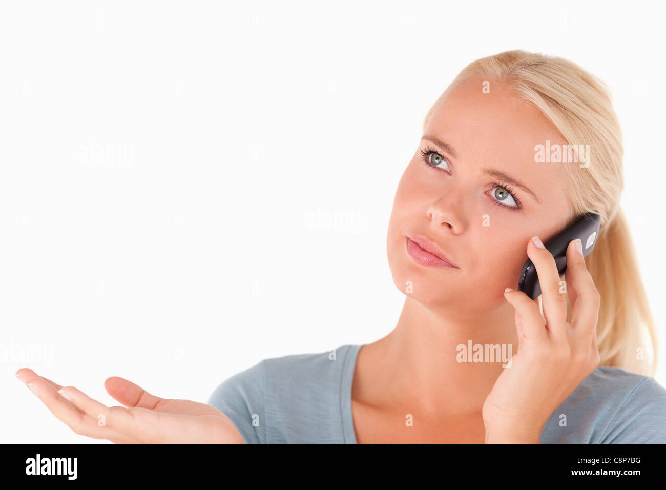 Clueless woman on the phone Stock Photo Alamy