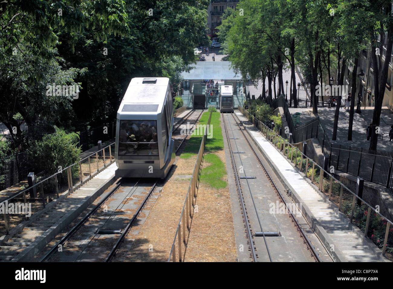Looking down on the funicular railway that runs up the side of Montmartre, Paris. Steps of Rue Foyatier on the right. Stock Photo