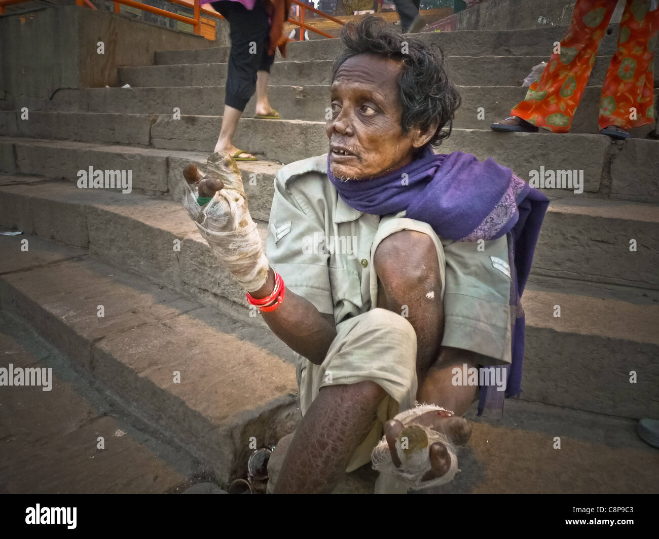 Varanasi (Benares) Where people come to die INDIAN Glance, Lepers on the main steps of the Ghat of Benares Stock Photo