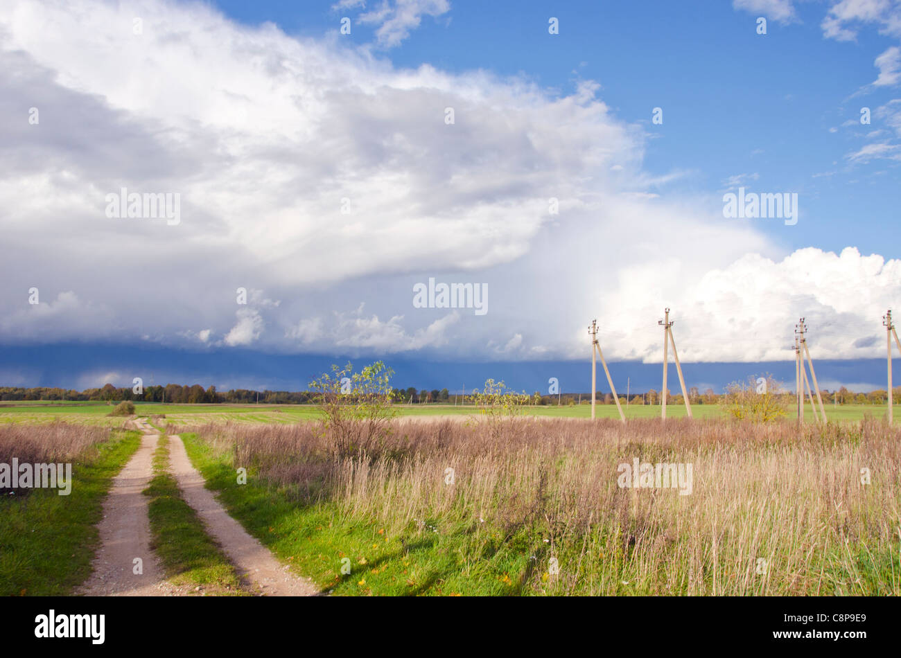 autumn rural landscape with road and rain clouds Stock Photo - Alamy