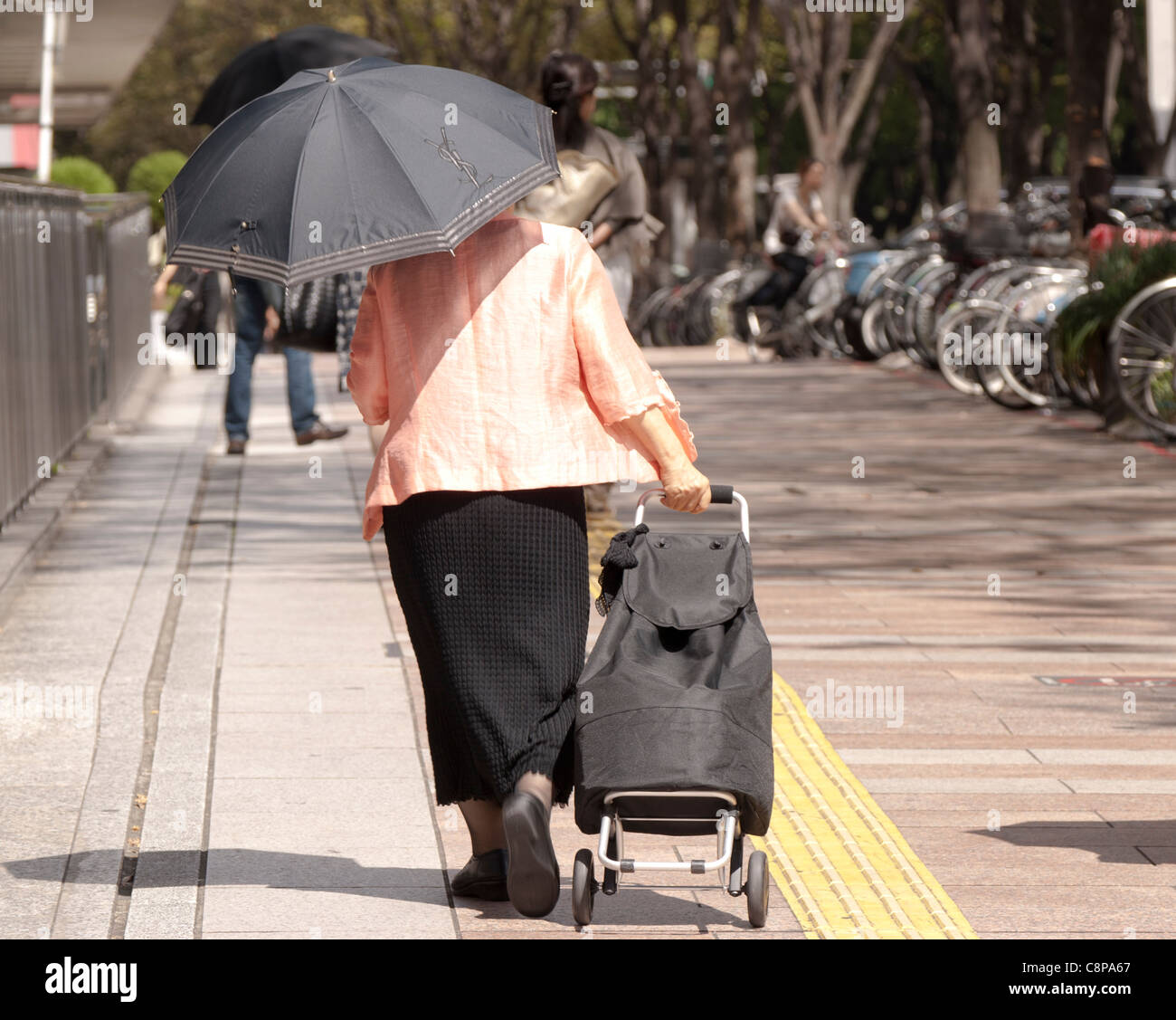 An elderly lady with a sun parasol, Nagoya, Aichi, Japan Stock ...