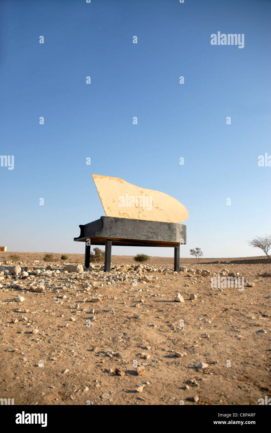 piano in the desert sun by day Stock Photo