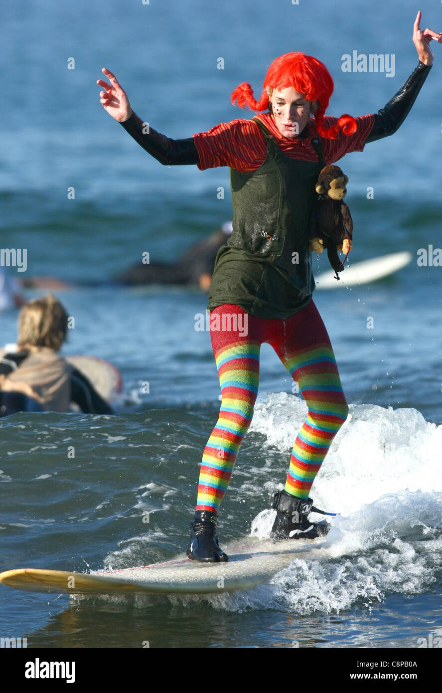 WOMAN SURFER AS PIPPI LONGSTOCKING BLACKIE'S HALLOWEEN COSTUME SURF