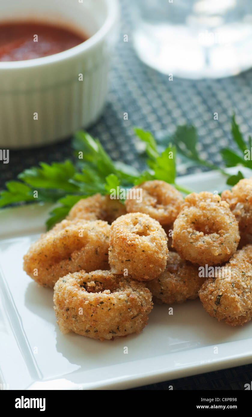 Breaded calamari starter with marinara sauce Stock Photo Alamy