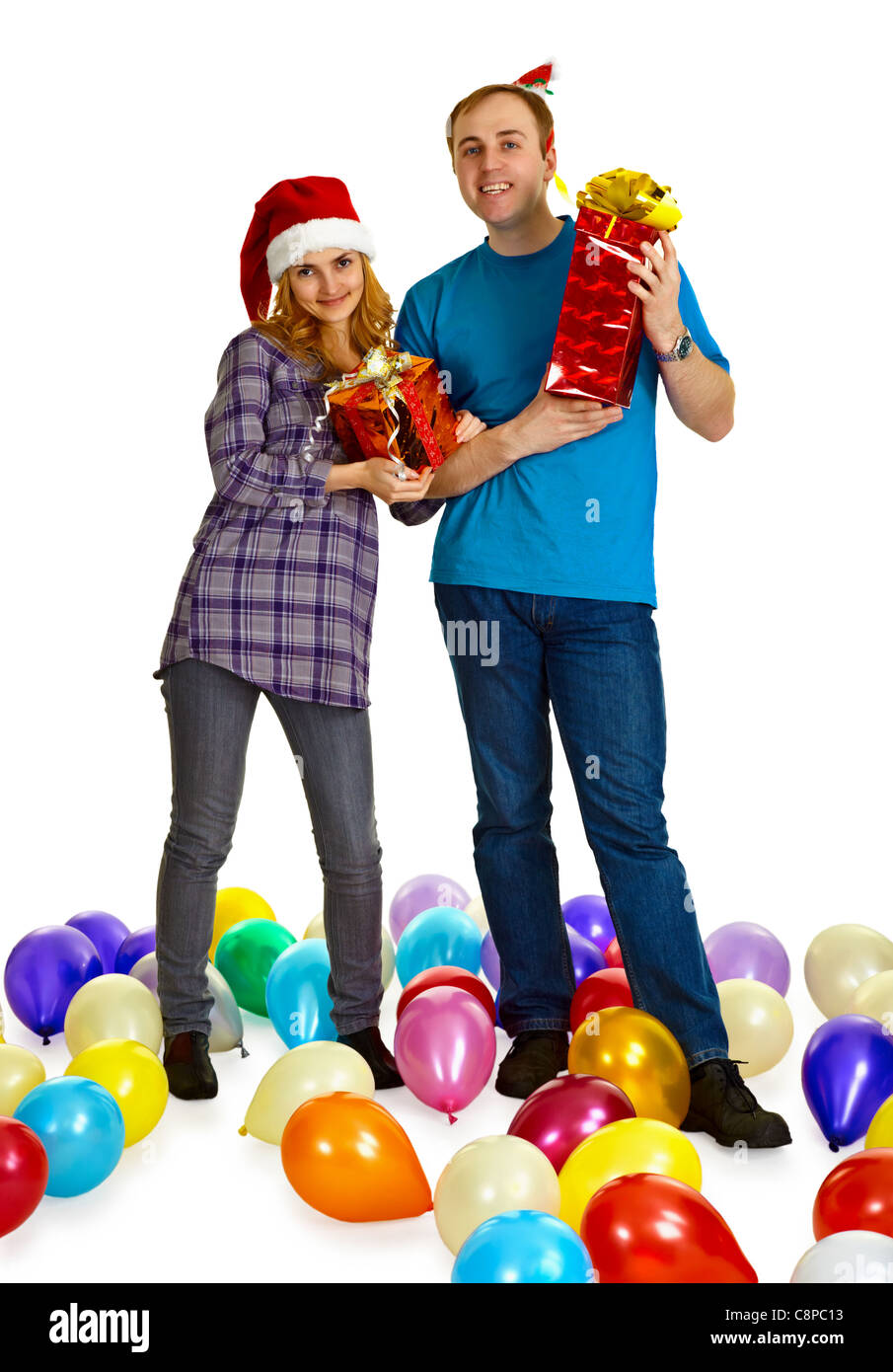A married couple with Christmas gifts isolated on white background