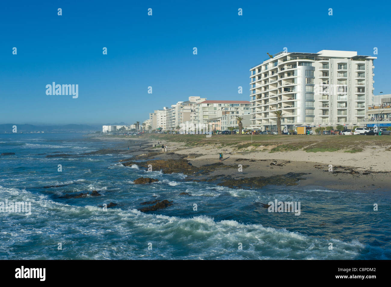 Coastline and apartment building along Beach Road Cape Town South Africa Stock Photo