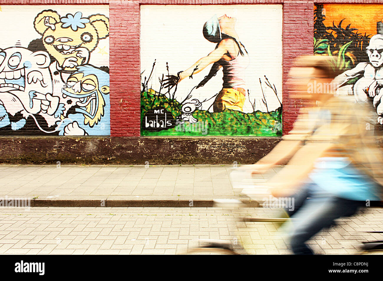 graffiti wall and biker in motion Stock Photo