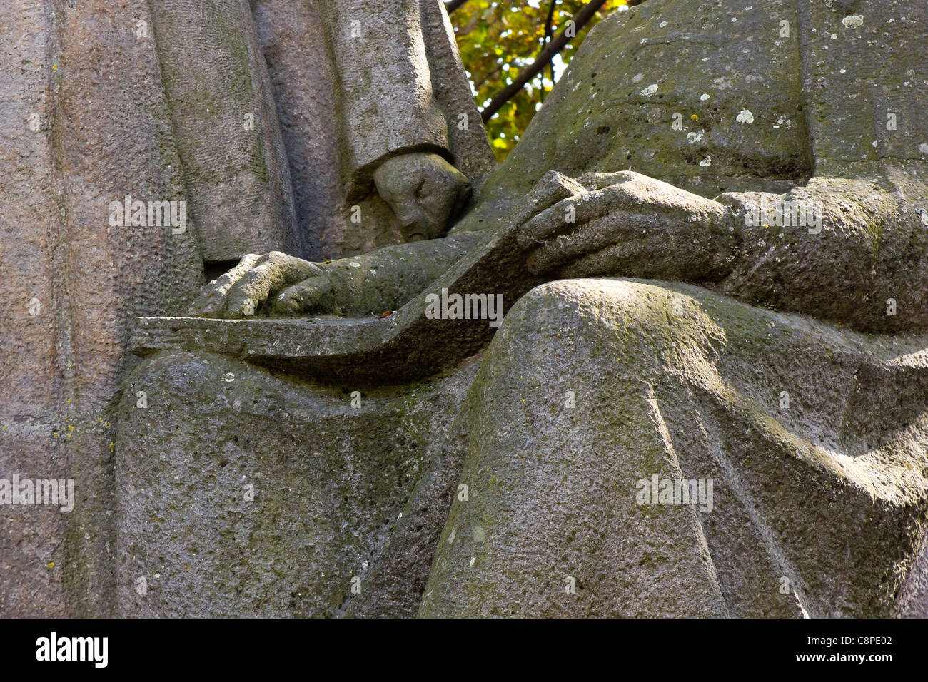 detailed view of a reading stone statue Stock Photo
