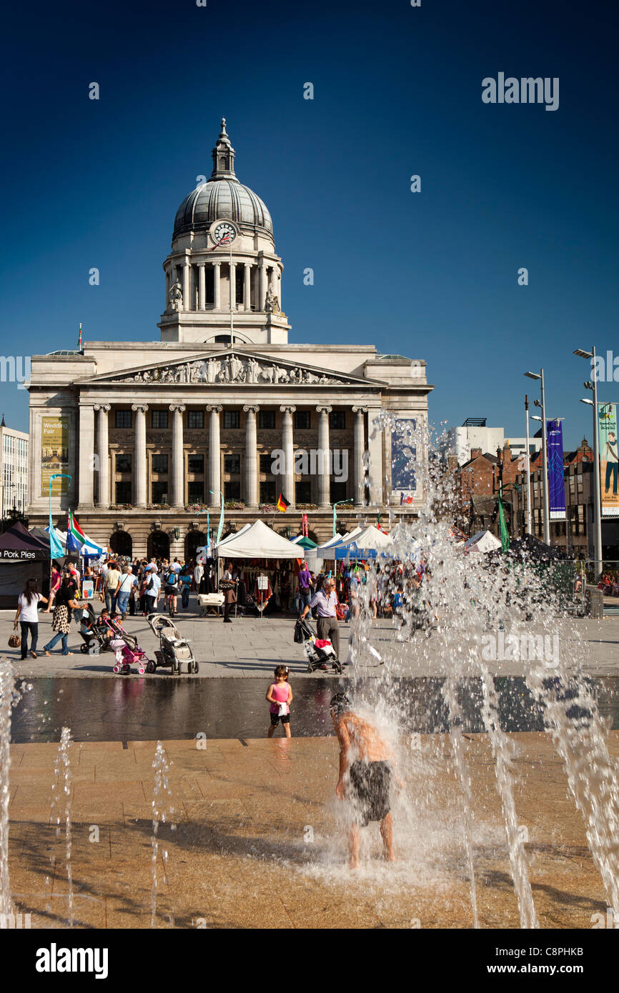 UK, Nottinghamshire, Nottingham, Old Market Square, children playing in fountains on hot sunny day Stock Photo