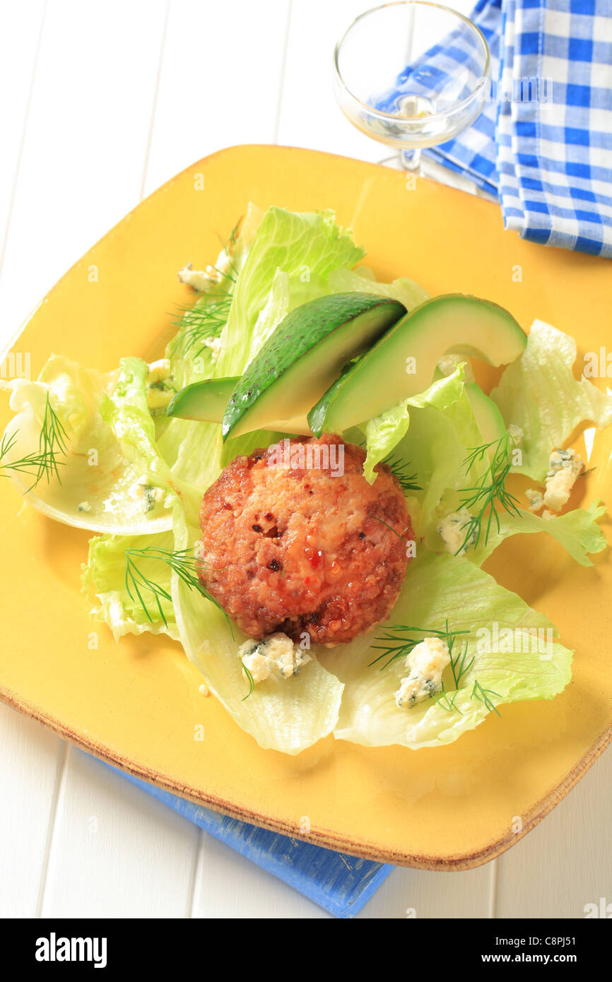 Meat patty with lettuce, avocado and blue cheese Stock Photo