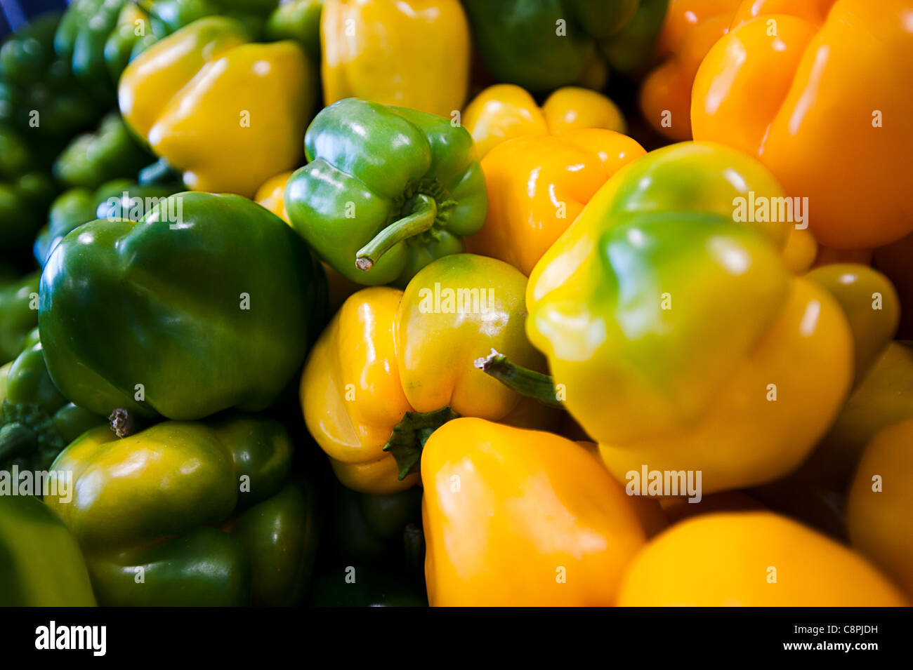 Green and yellow peppers in the market Stock Photo - Alamy