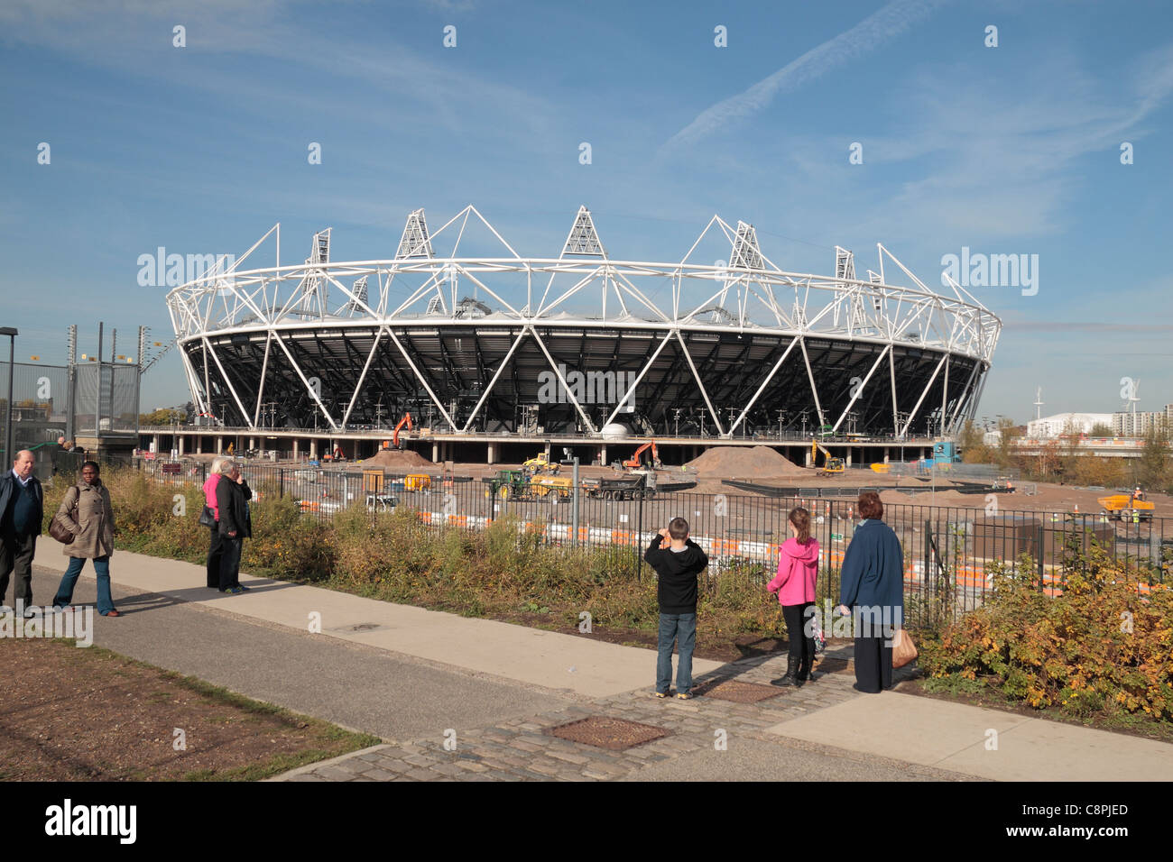 People visiting the nearly complete (in Oct 2011) London 2012 Olympic Athletics Stadium in Stratford, London. Stock Photo