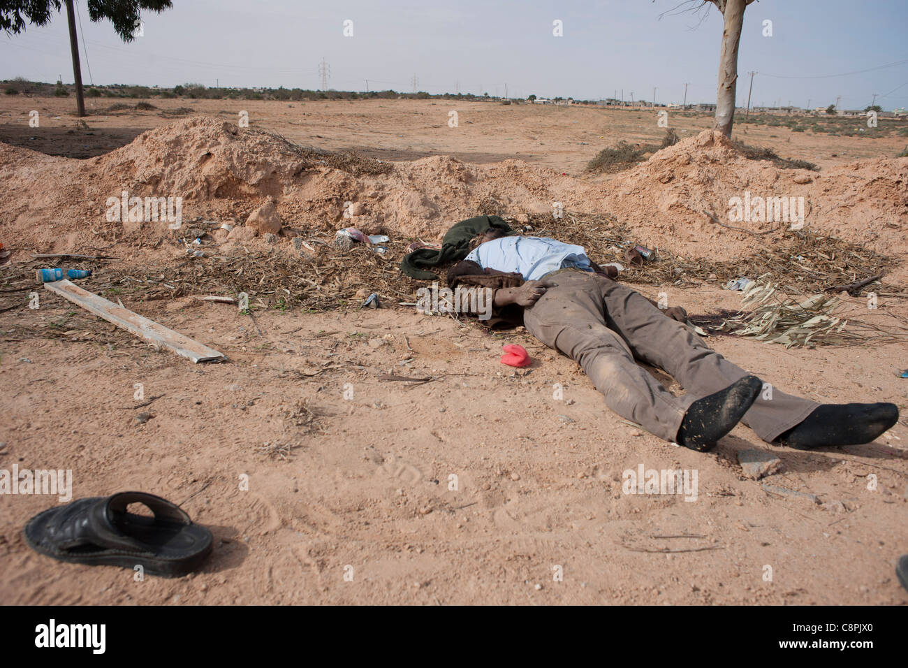 One of colonel Gaddafis guards lays dead in the streets on Sirt after a NATO air strike on Gaddafi convoy. Stock Photo