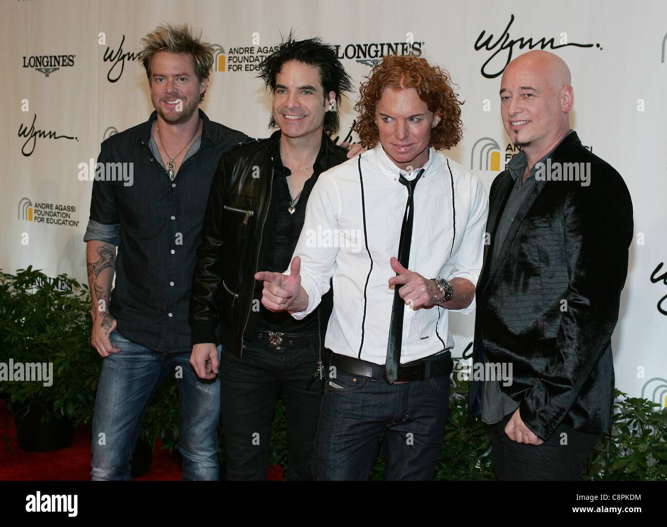 Train, Carrot Top at arrivals for 16th Andre Agassi Grand Slam for Children Benefit Concert, Wynn Las Vegas, Las Vegas, NV October 29, 2011. Photo By: James Atoa/Everett Collection Stock Photo