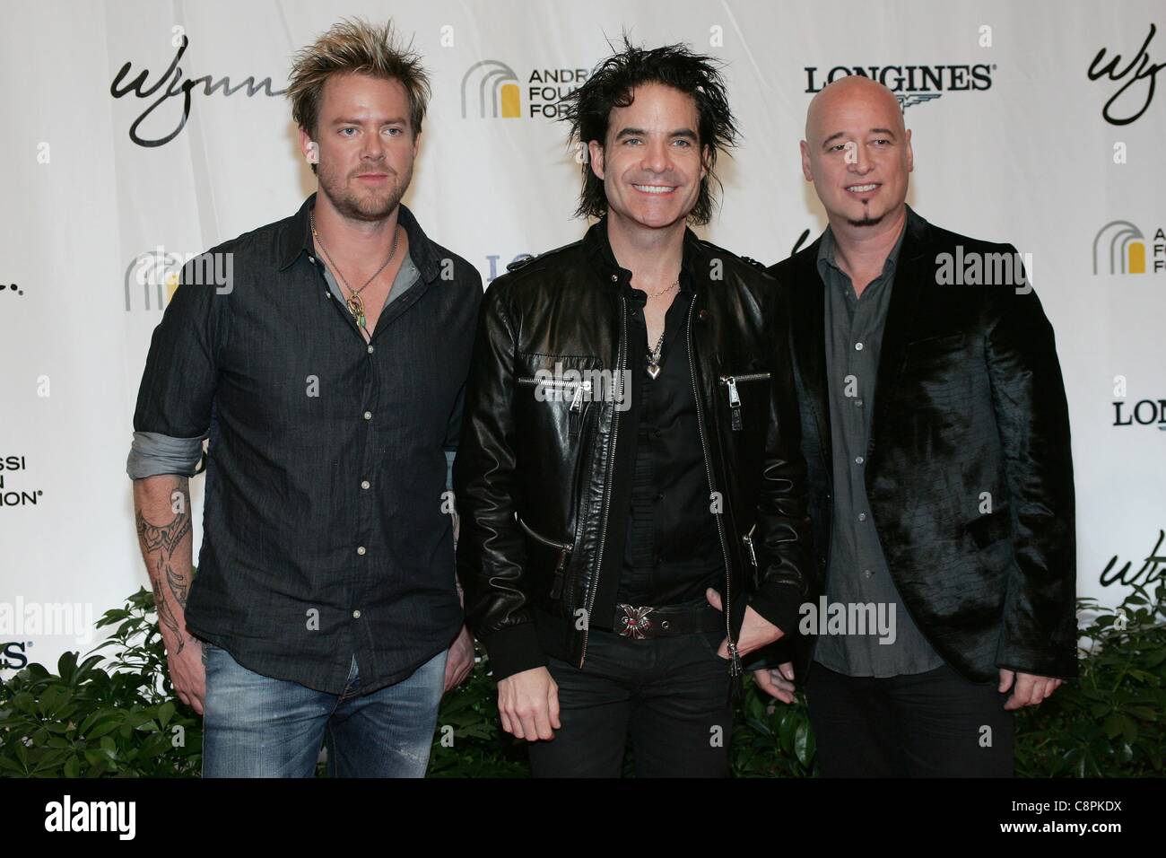 Scott Underwood, Patrick Monahan, Jimmy Stafford of Train at arrivals for 16th Andre Agassi Grand Slam for Children Benefit Concert, Wynn Las Vegas, Las Vegas, NV October 29, 2011. Photo By: James Atoa/Everett Collection Stock Photo