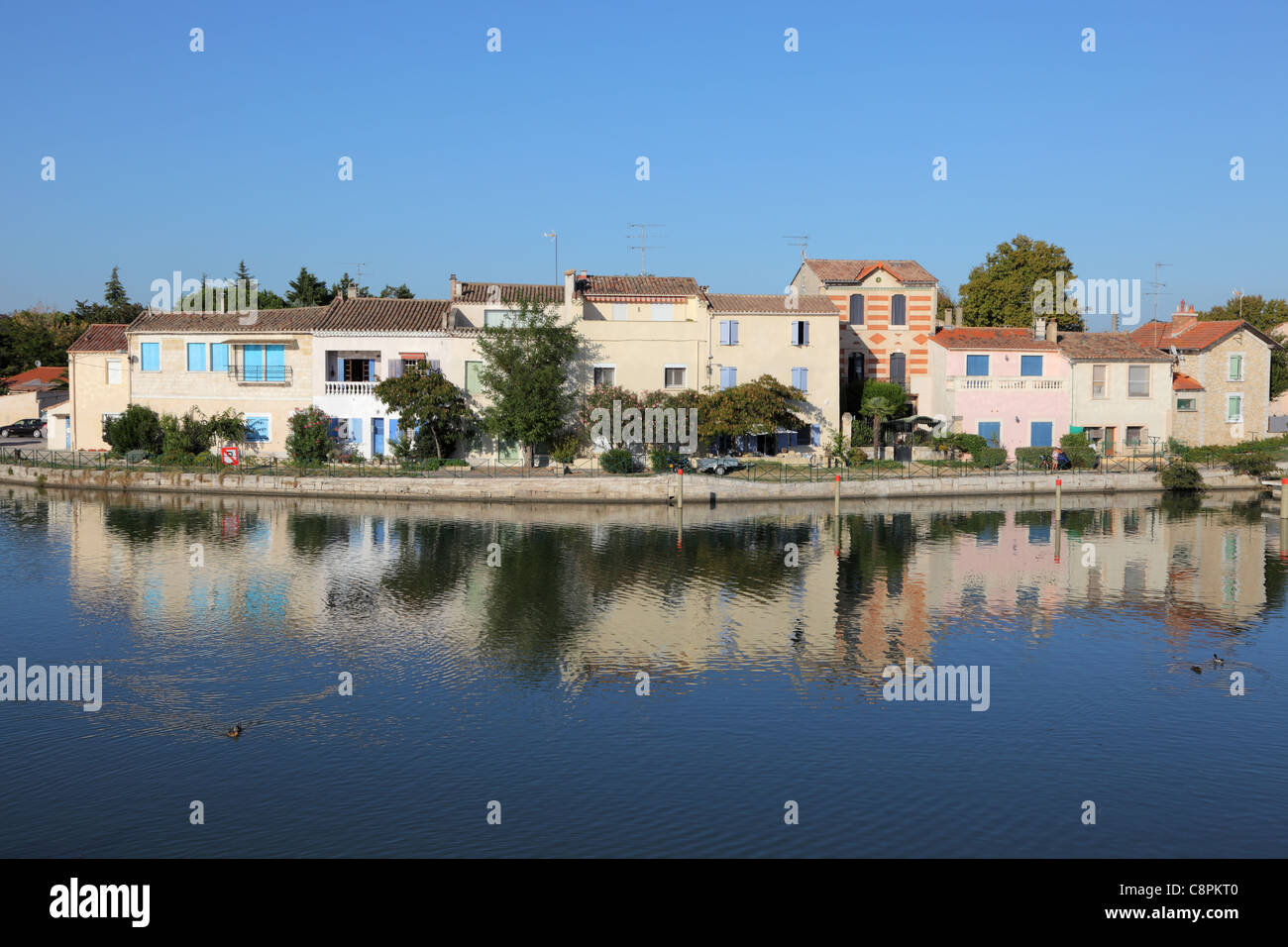 Houses waterside in Aigues-Mortes, southern France Stock Photo