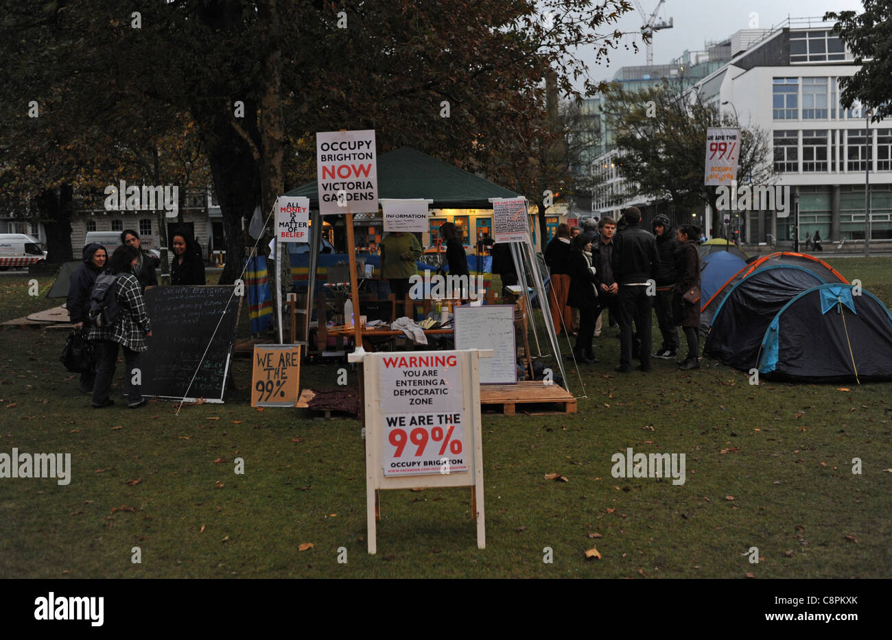 The latest anti capitalist tented protest Occupy Brighton in Victoria Gardens in the city centre UK at dusk Stock Photo