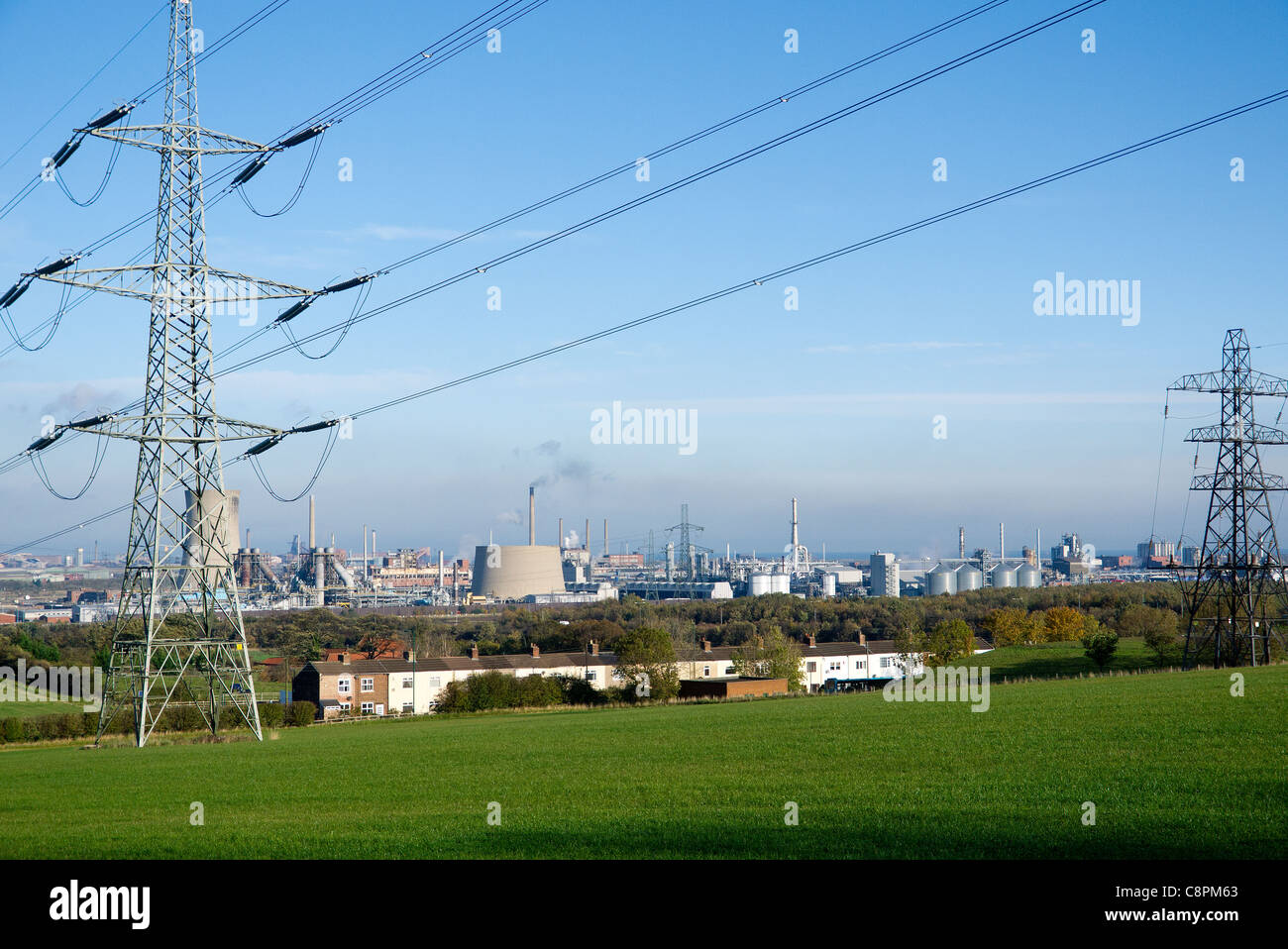 Wilton site chemical plant and Teesside Gas turbine power station electrical power distribution Transmission towers or  pylons Stock Photo