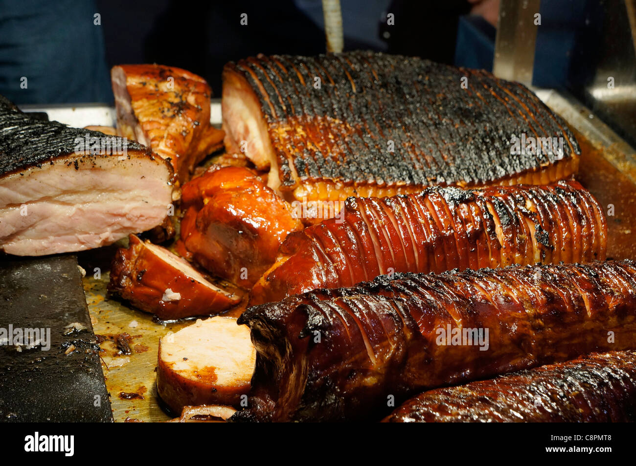 Roast Ham, Sliced Charred Bacon at a Deli Stock Photo