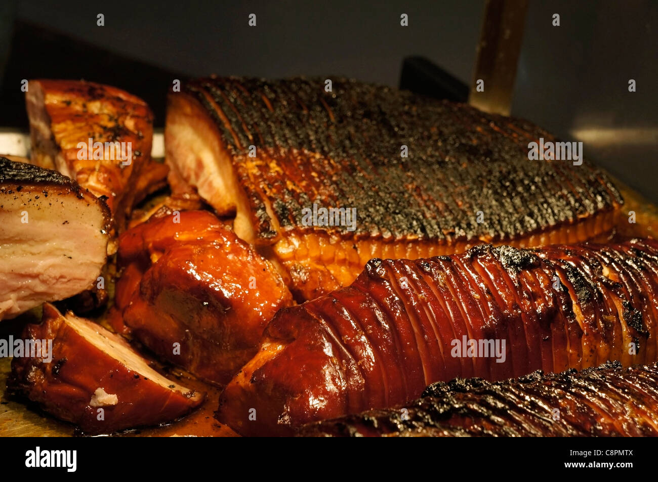 Roast Ham, Sliced Charred Bacon at a Deli Stock Photo