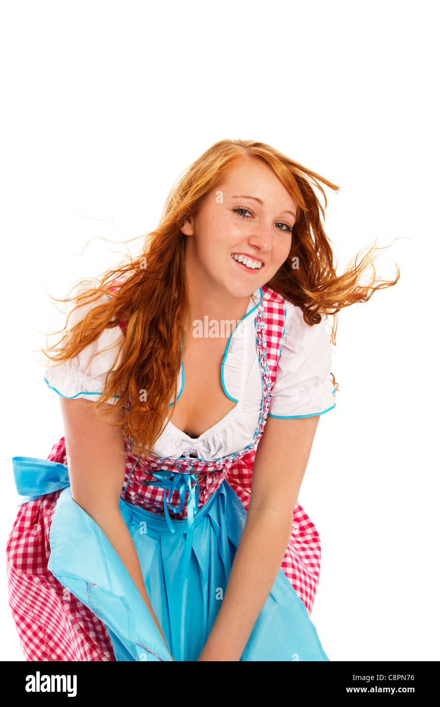 woman in bavarian dress handling with wind on white background Stock Photo