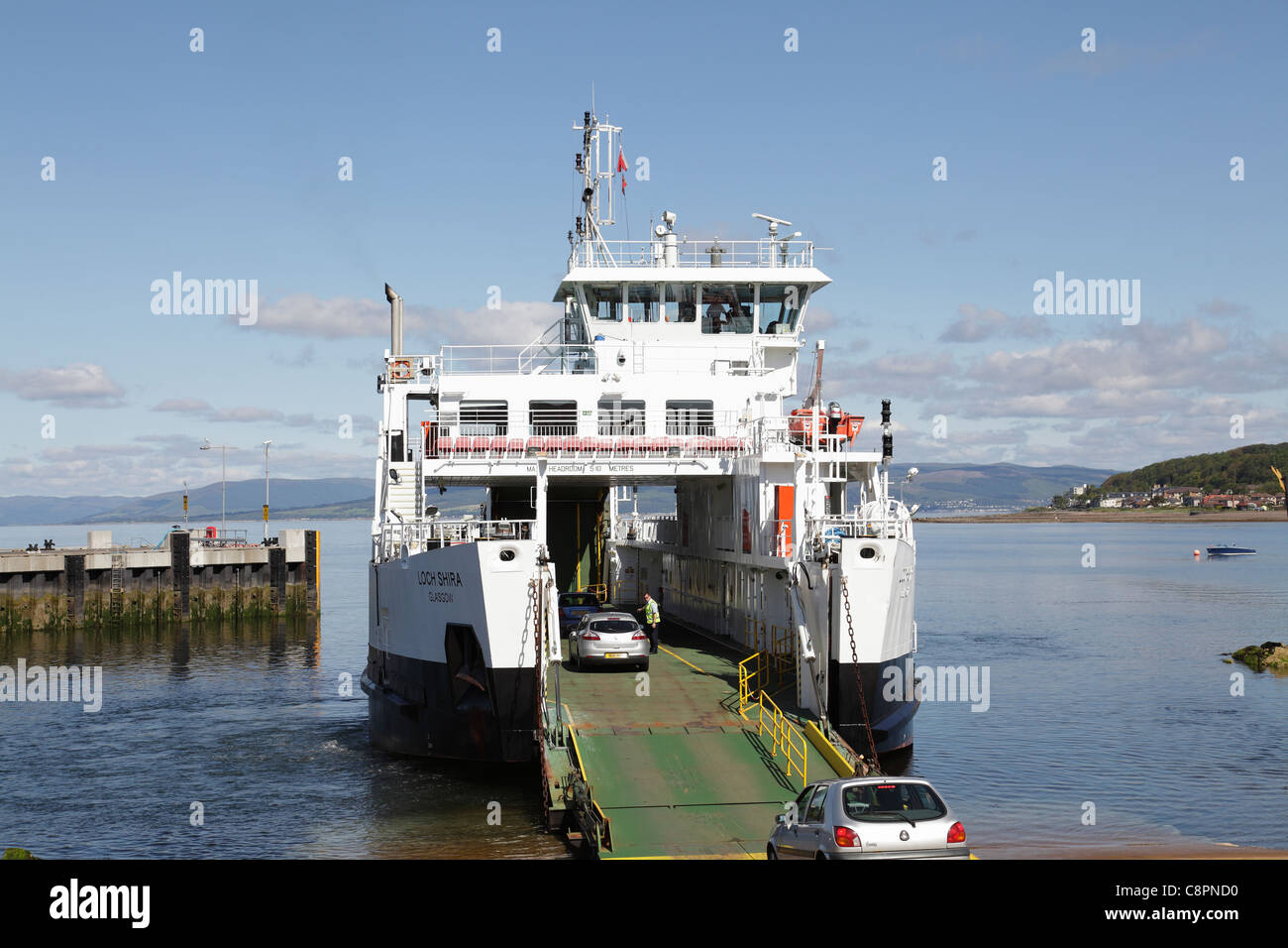 Cars boarding a Calmac Ferry in Largs harbour on the Firth of Clyde to travel to the Island of Great Cumbrae, Scotland, UK Stock Photo