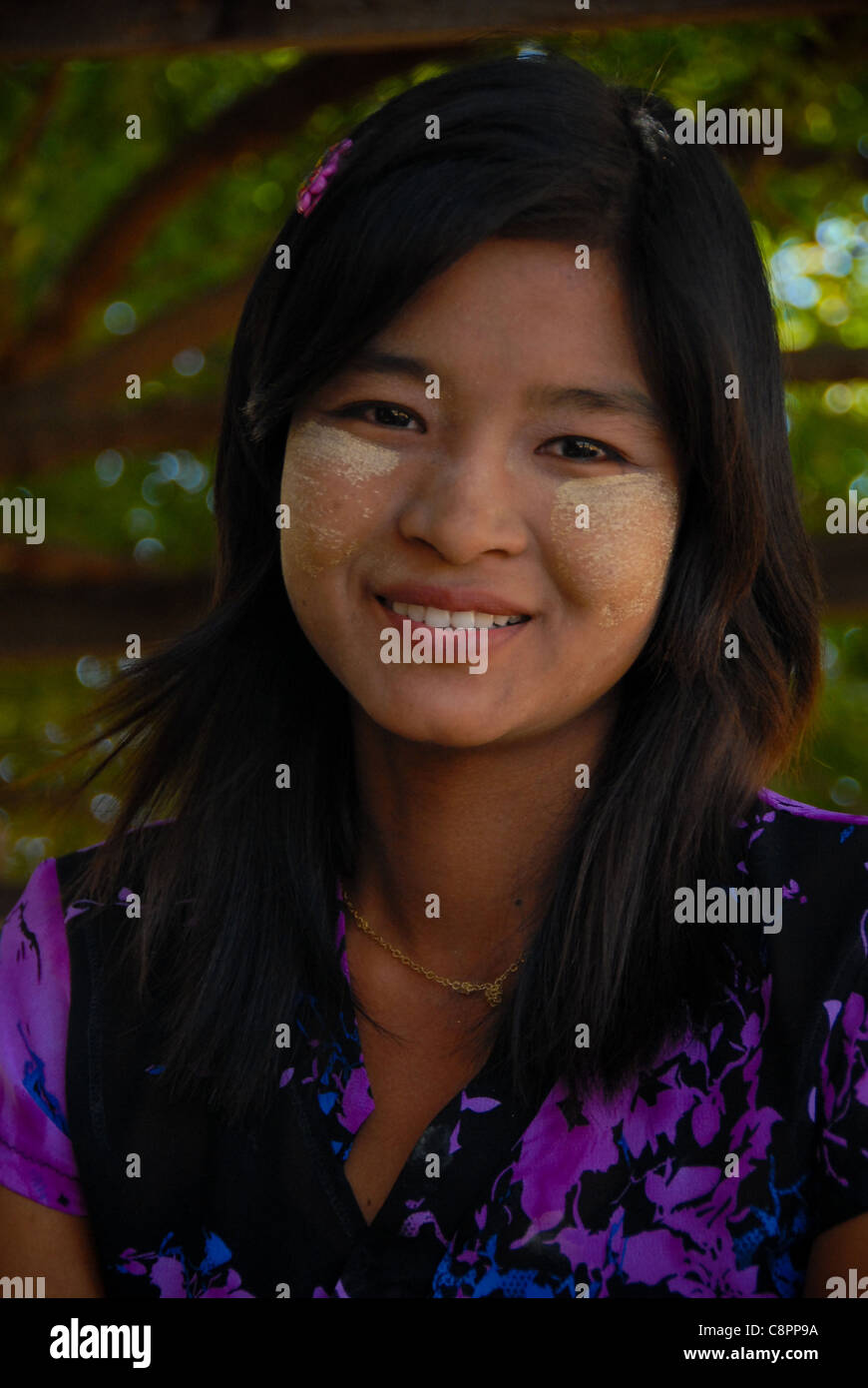 A smiling burmese girl with thanaka, traditional make-up,  in Bagan, Myanmar (Burma). Stock Photo