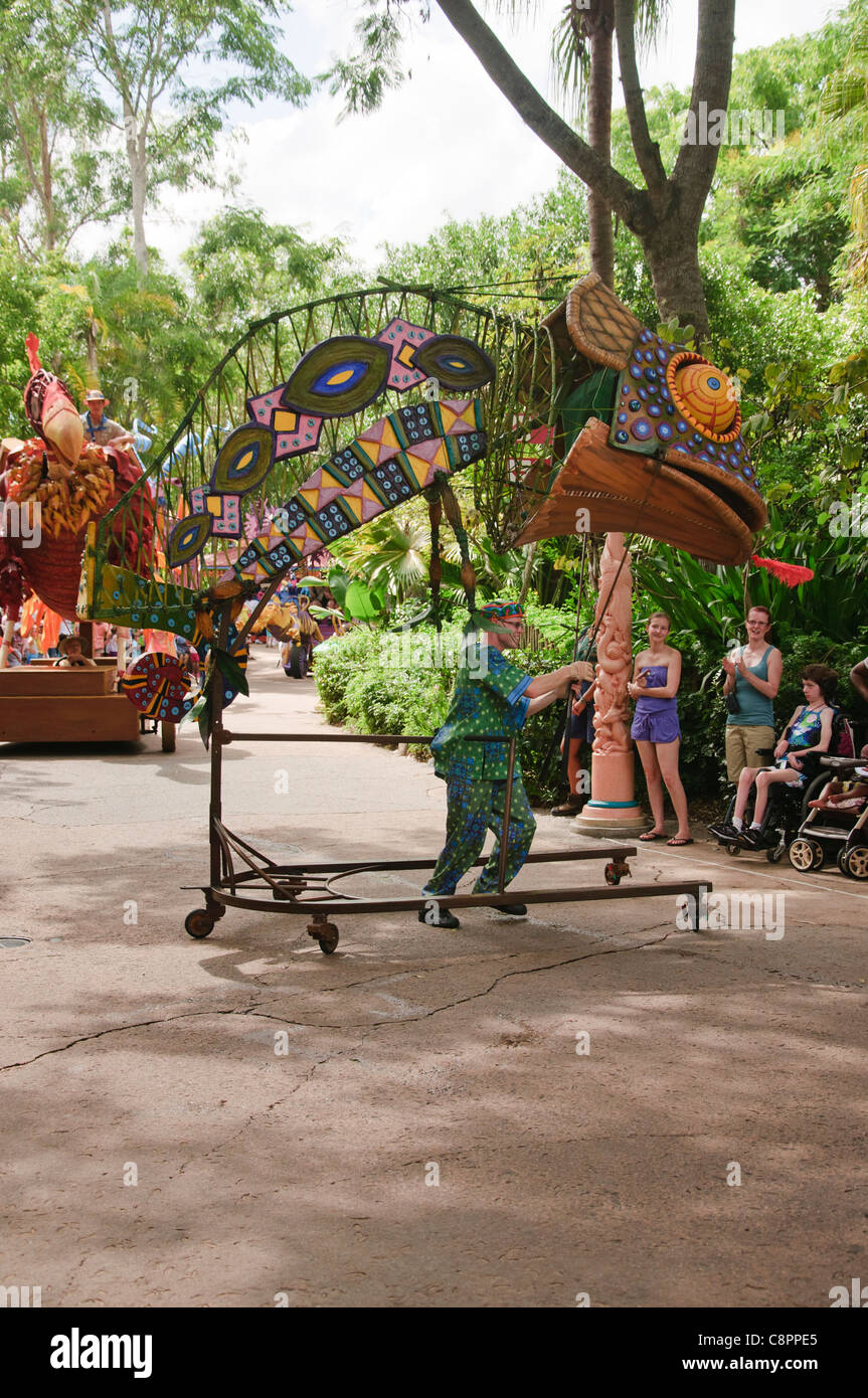 street entertainers and floats in mickeys jammin jungle parade in the
