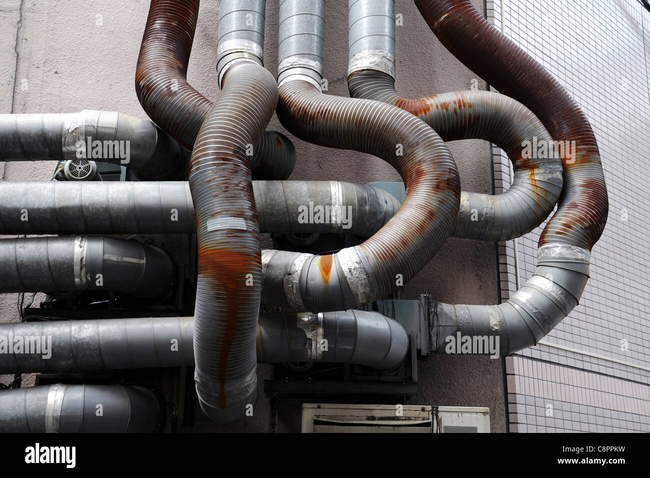 Industrial building with rusted pipe Stock Photo